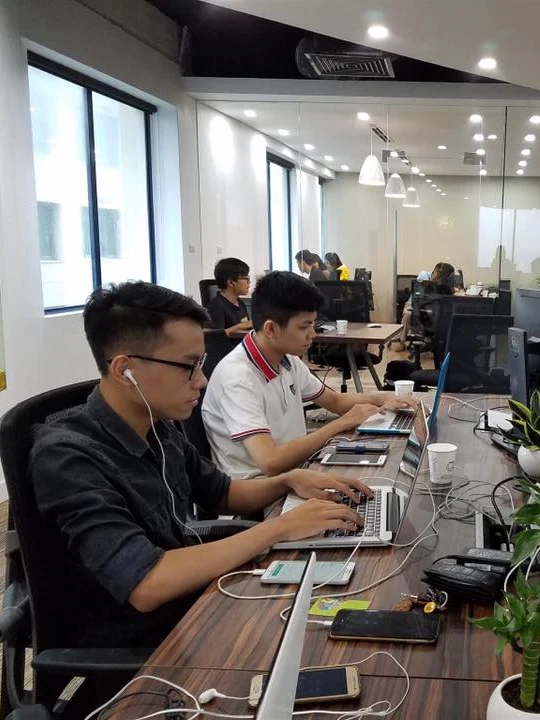 Engineers working on the TechHub engineering floor in Hanoi